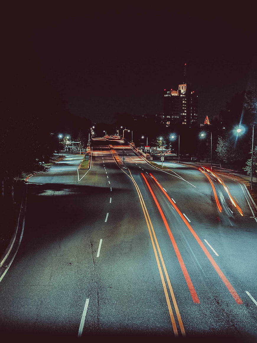 Long exposure night city street with light trails