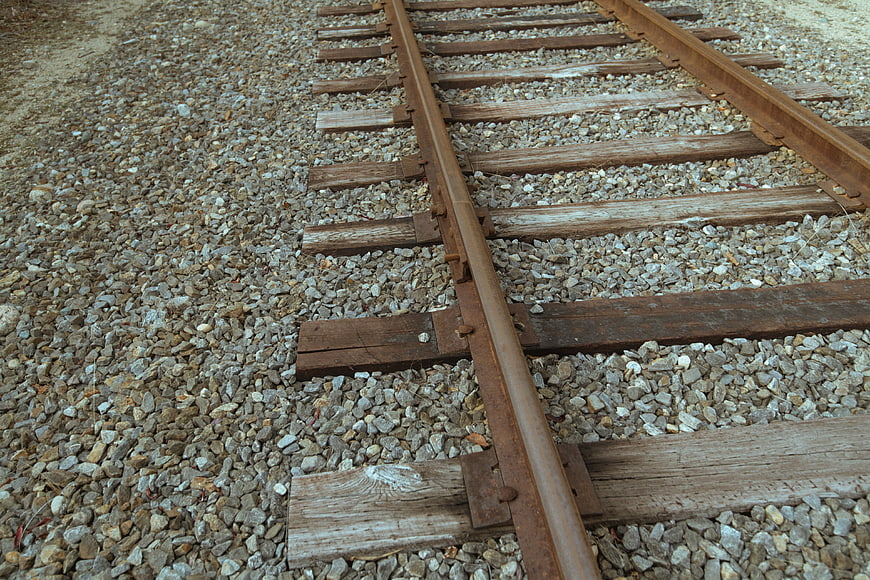 Rusty Railway Tracks on Gravel Ballast
