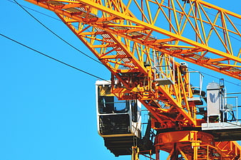 Yellow Construction Crane Against Blue Sky