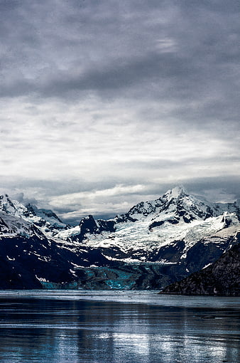 Dramatic Snow-Capped Mountains and Glacier Lake Landscape