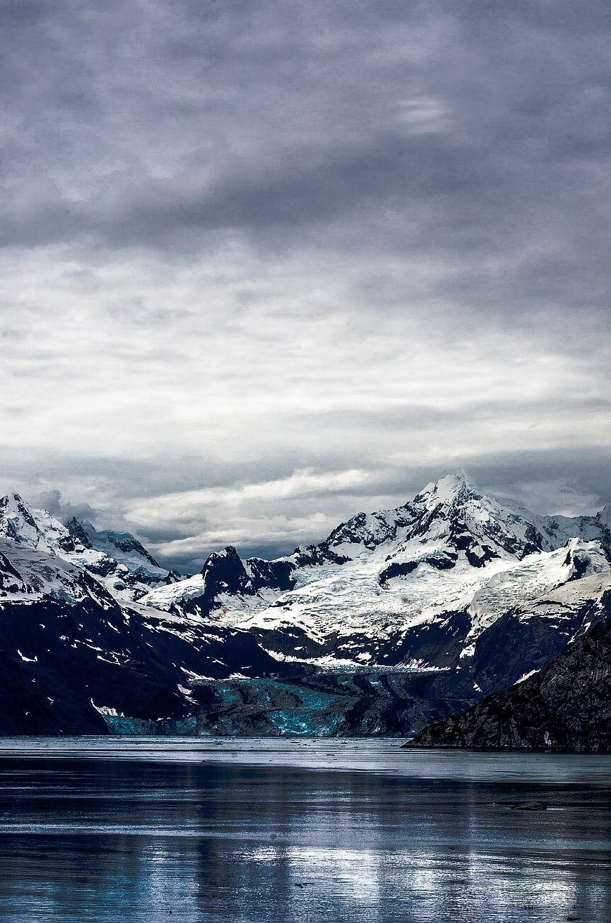 Dramatic Snow-Capped Mountains and Glacier Lake Landscape
