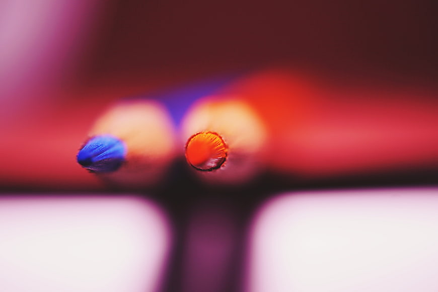 Macro shot of blue and orange colored pencil tips