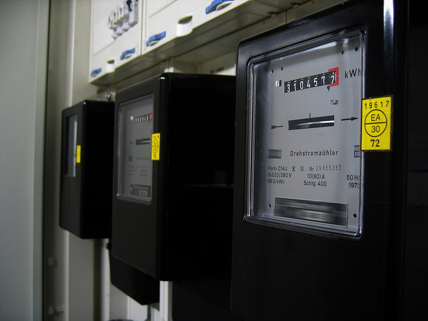 Close-up of industrial electricity meters on a wall