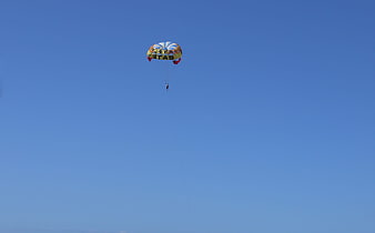 Parasailing Adventure Against Clear Blue Sky