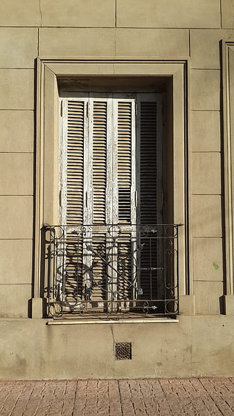 Old European Window with Shutters and Iron Balcony