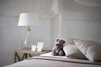Cozy Bedroom Interior with Teddy Bear and Lamp