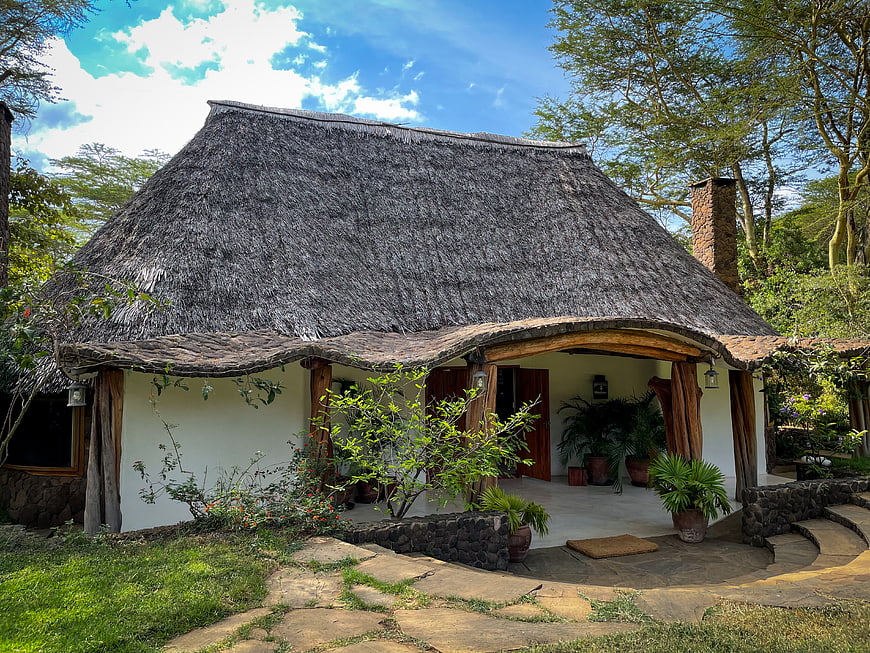 Rustic Thatched Roof Cottage in Lush Tropical Garden