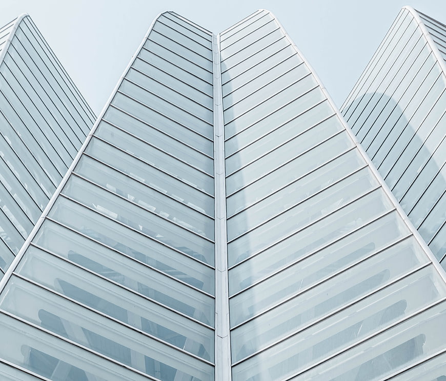 Low angle view of modern glass skyscraper architecture