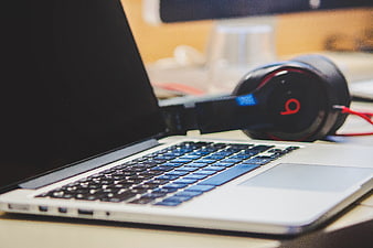 Laptop and Headphones on Desk Workspace
