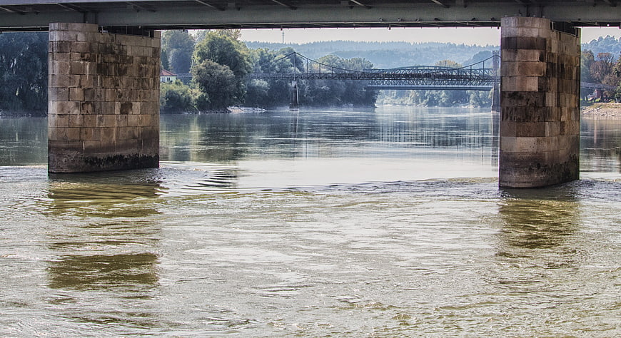 View of Inn River and Suspension Bridge from Underneath Bridge in Passau