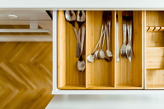 Organized kitchen drawer with silverware in bamboo dividers