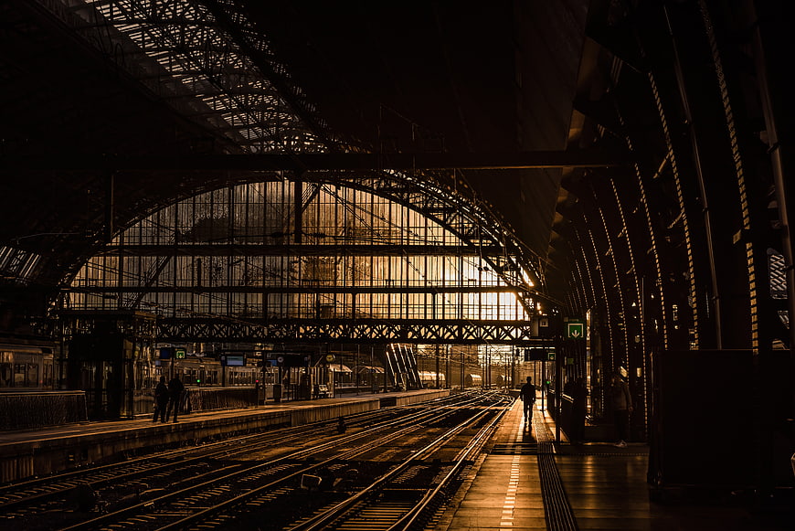 Silhouette of Train Station Interior with Golden Hour Light