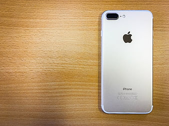 Silver Apple iPhone 7 Plus Back View On Wooden Desk