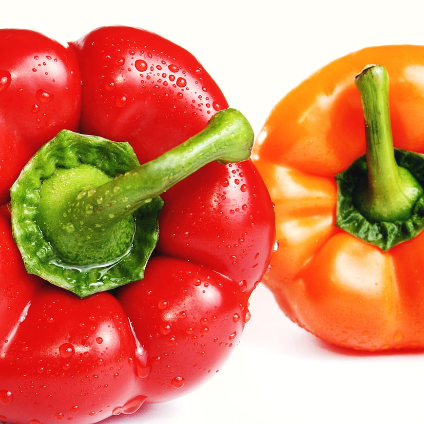 Fresh Red and Orange Bell Peppers with Water Droplets