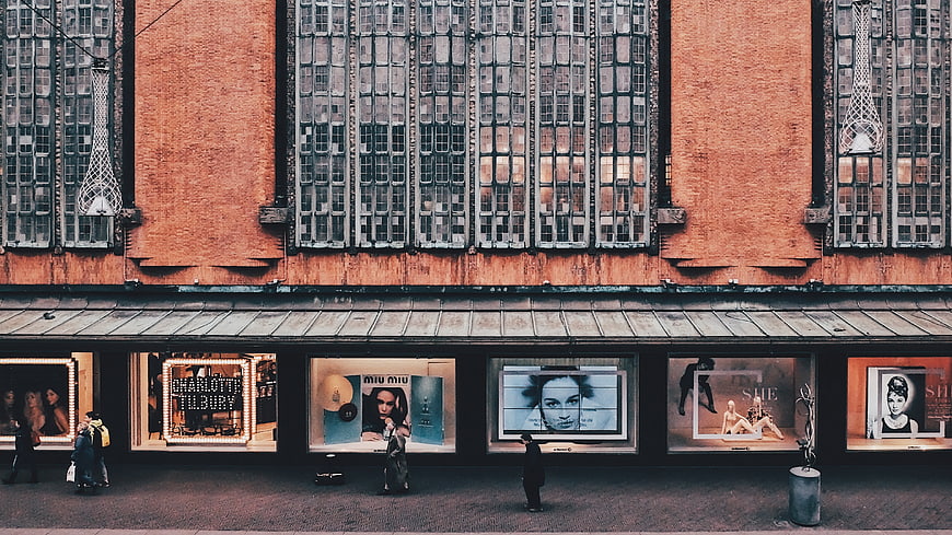 High Angle View of Brick Building with Fashion Storefronts