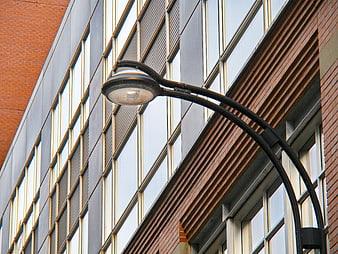 Modern building facade with curved street lamp