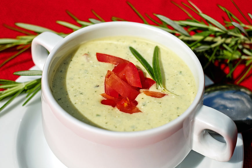 Creamy Zucchini Yogurt Soup Garnished With Tomato And Rosemary