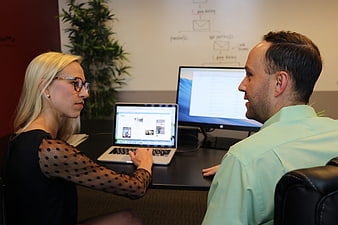 Business meeting with laptop and whiteboard in modern office