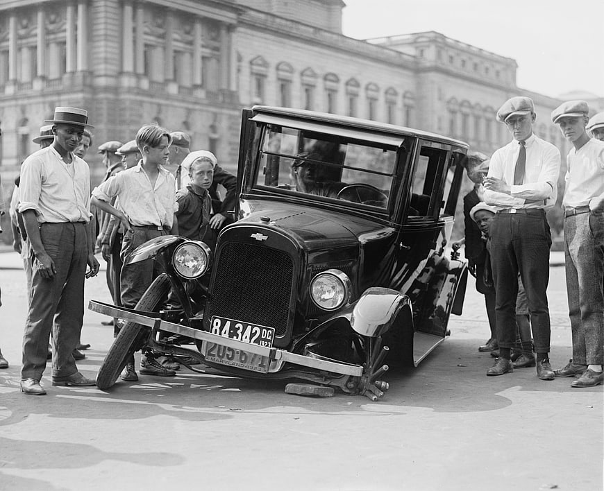 Vintage 1920s Chevrolet with Broken Axle Surrounded by Boys