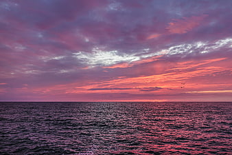 Dramatic Purple and Orange Sunset Over the Sea