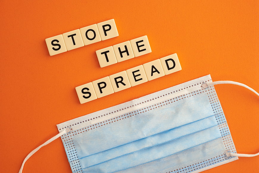 Stop the Spread Scrabble Tiles and Surgical Mask on Orange