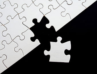 Missing white puzzle piece on black background