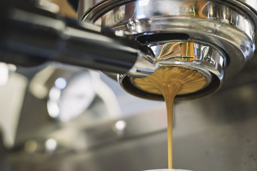 Close-up of espresso pouring from portafilter