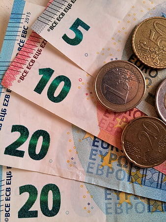 Euro banknotes and coins flat lay