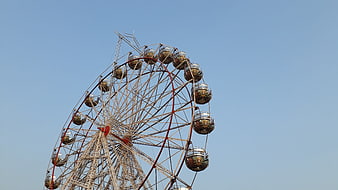 Vintage Ferris Wheel Against Clear Blue Sky