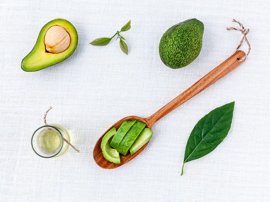 Fresh Avocado and Oil Flat Lay on White Background