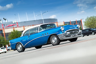 Blue Vintage Buick Special Classic Car Driving on Street