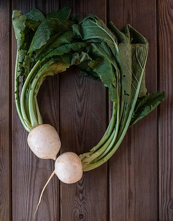 Fresh Turnips Arranged in Heart Shape on Wooden Background