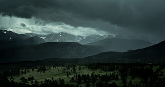 Dramatic Storm Clouds Over Mountain Valley Landscape