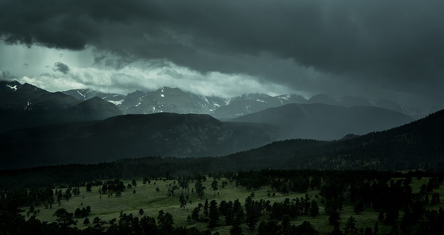 Dramatic Storm Clouds Over Mountain Valley Landscape