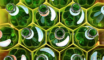 Top View of Green Glass Bottles in Yellow Hexagonal Crate