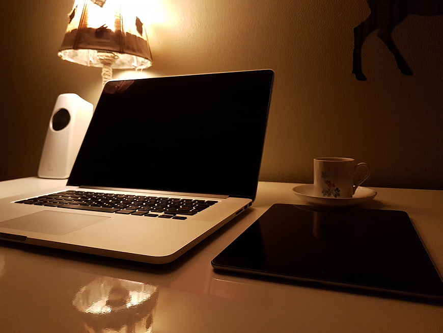 Cozy Home Office Setup with Laptop and Coffee