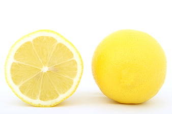 Fresh Yellow Lemon Whole and Sliced on White Background