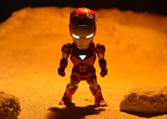 Glowing Iron Man Action Figure on Sandy Terrain