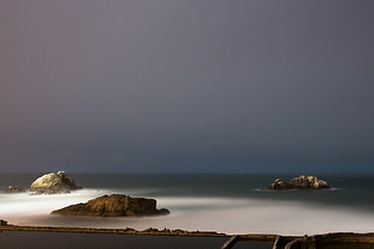 Long Exposure Misty Ocean Rocks at Dusk
