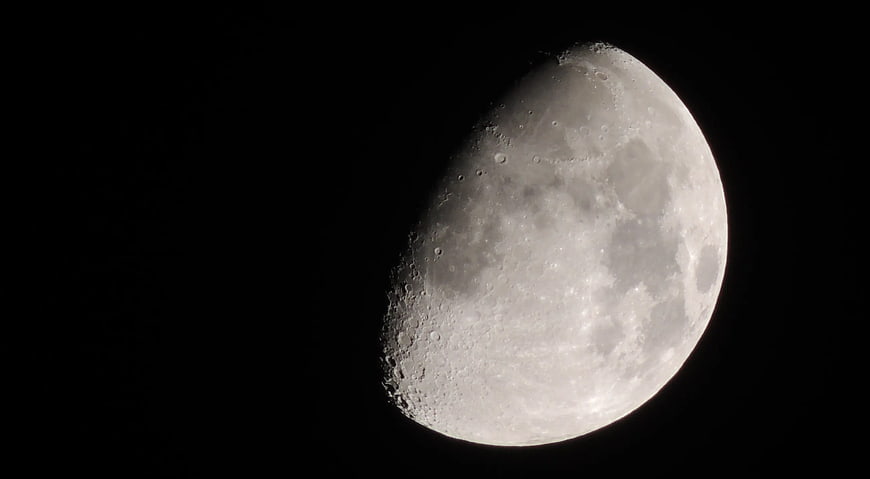 Detailed Crescent Moon Phase Against Black Night Sky