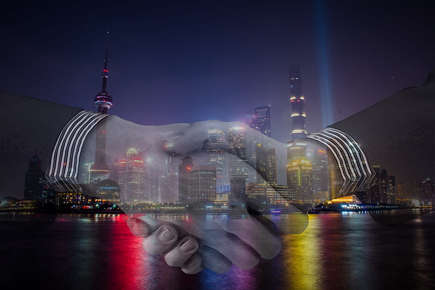 Double Exposure Business Handshake Shanghai Skyline