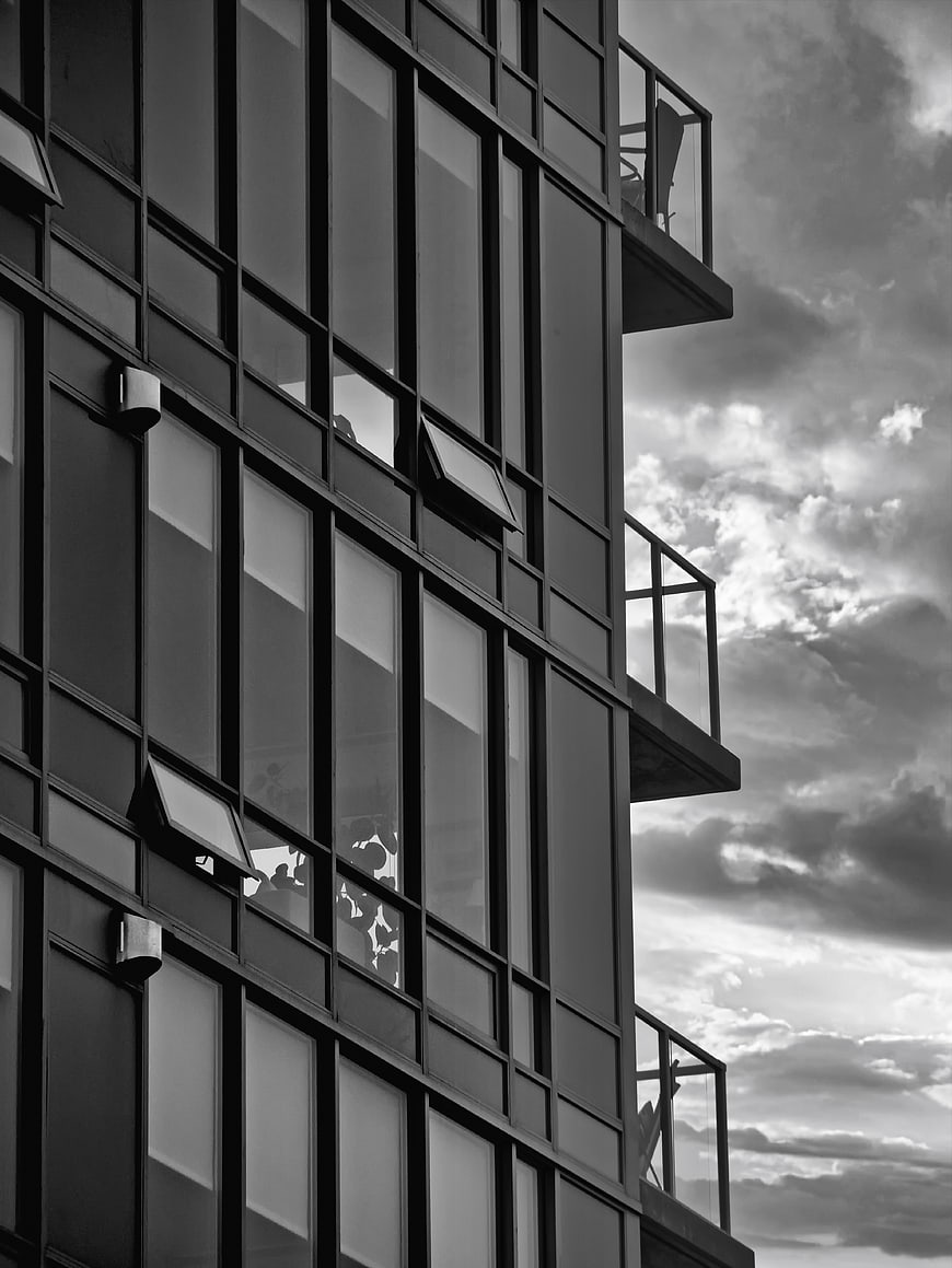 Modern Black and White Apartment Building Facade with Balconies