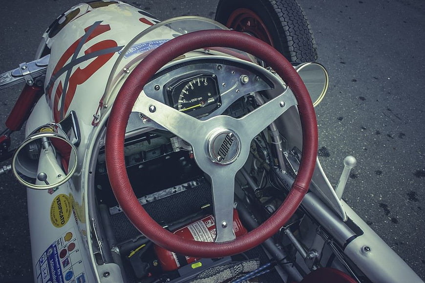 Vintage Racing Car Cockpit with Red Steering Wheel