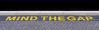 Mind the Gap Warning on Subway Platform Edge