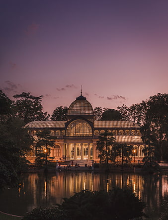 Crystal Palace in Retiro Park, Madrid at Dusk with Water Reflections