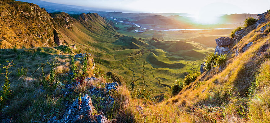 Panoramic View of Rolling Green Hills and Valley at Golden Hour