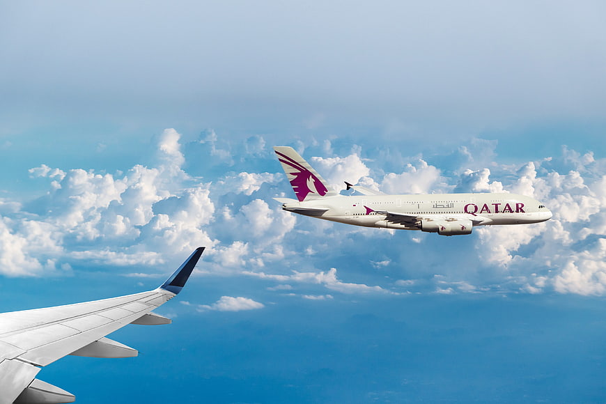 Qatar Airways A380 Flying Above Clouds with Wing View