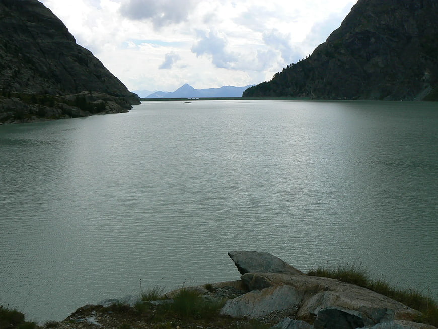 Serene Mountain Lake Surrounded by Rocky Slopes