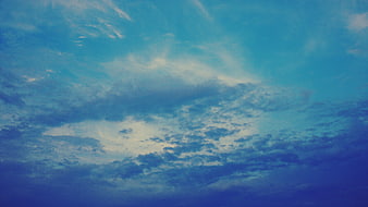 Dramatic Blue Sky with Wispy Clouds and Vintage Film Grain