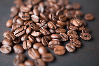 Roasted Coffee Beans on Dark Wooden Surface